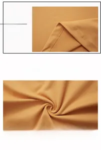 Macro detail of ginger yellow sports fabric showing smooth stitching and breathable texture