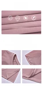 Detail view of pink modal fabric with mesh splicing sleeves and side split hem on sports tee