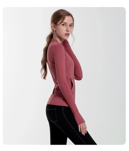 Detail view of the slim-fit athletic top featuring a stand collar and side zip pockets
