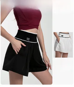Detail of high waisted sports shorts with BK logo elastic waistband and side pockets