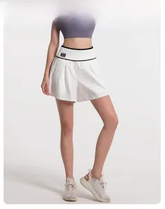Detail view of white high-waist fake two-piece sports shorts with contrast waistband
