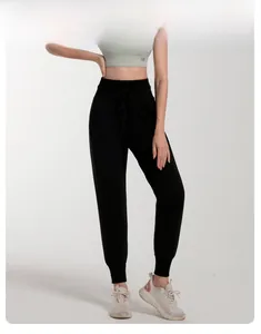High-waisted black joggers with drawstring waist and elastic cuffs for a sporty look
