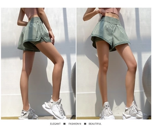 Detailansicht der hellgrünen Doppel-Lagen-Sporthose mit breitem elastischem Bund