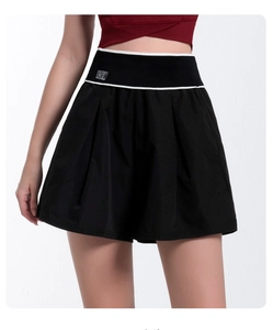 Detail view of high-waist pleated sports shorts with BK logo and contrast waistband