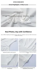 Gros plan du tissu du gilet de sport blanc à capuche montrant la texture respirante en modal