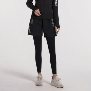 Completo sportivo donna nero con pantaloni 2-in-1 riflettenti e giacca fitness con cerniera