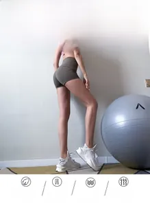 Close-up of high-waisted fitness shorts with moisture-wicking fabric and booty-lifting seam