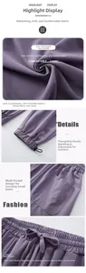 Detail view of high waist waistband with drawstring and adjustable elastic cuffs on purple pants