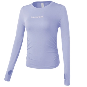 Slim fit lavender yoga crop top with side ruching, thumbholes, and Balance Care print