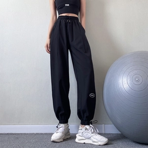 Women's black high-waisted jogger pants with drawstring and slim-fit quick-dry fabric