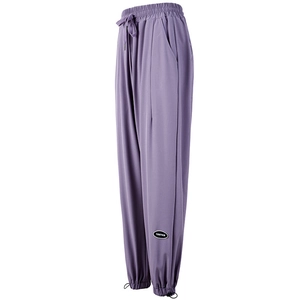 Slimming purple high-waisted jogger pants with adjustable drawstring waist and cuffs