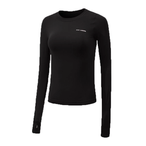 Detail of thumbhole cuffs and white logo on black slim fit athletic long sleeve yoga shirt