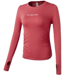 Coral long sleeve yoga crop top with side drawstring and Balance Care print