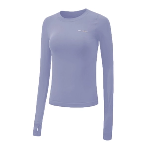 Detail of light purple yoga top featuring thumbholes and moisture-wicking stretch fabric