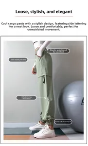 Detail of light green cargo pants showing elastic waistband and side pocket features