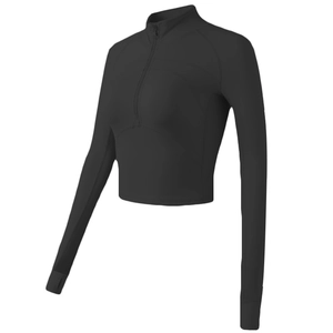Slim fit black long sleeve sports top with stand collar, half-zipper, and thumbholes