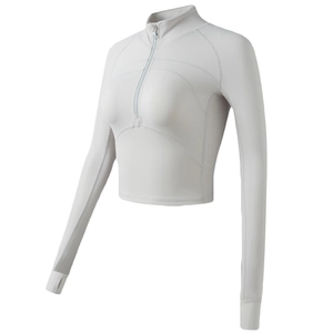 Slim fit white yoga crop top with half-zipper and thumb holes for women’s fitness