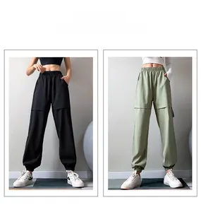 Detail view of high-waist cargo pants featuring double-layer stitching in black and green