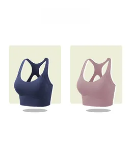 Vista dettagliata dei reggiseni sportivi con dorso a vogatore in blu scuro e rosa malva