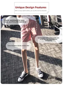 Dettaglio dei pantaloncini sportivi rosa con stampa di lettere e vita elastica comoda