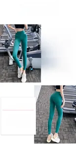Détail du legging de yoga taille haute bleu sarcelle avec coutures sculptantes fessiers