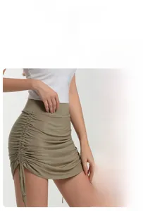 Detail view of high-waist yoga shorts with drawstring sides and anti-exposure lining
