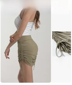 Detail view of high waisted sports shorts featuring adjustable side ruched drawstrings