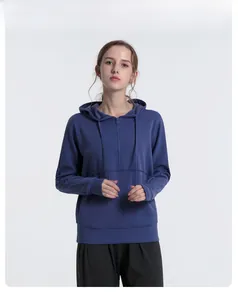 Detail of navy half-zip hoodie featuring adjustable drawstring hood and large pouch pocket