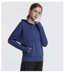 Detailed close-up of dark blue hoodie with half-zip design and durable metal zipper
