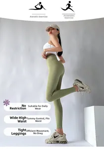 Detail of high-waisted olive leggings featuring a supportive tummy control waistband