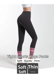 Detail of high waist yoga leggings showing the pink and purple color block on the hem