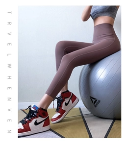 Macro detail of high-waisted fitness leggings showing breathable fabric and tummy control fit