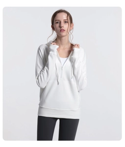 Detail of white women's athletic hoodie with half-zip design and drawstring hood details