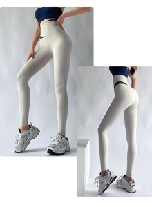 Detail of high-waisted yoga leggings featuring a contrast navy blue waistband design