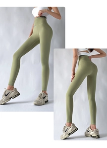 Detail of high-waisted avocado green yoga pants with tummy control and patchwork waistband