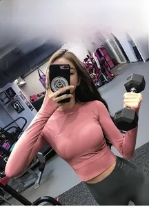 Close-up of pink long-sleeve crop top yoga shirt made with high-elastic dry-fit fabric
