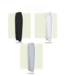 Detail of high waist joggers featuring a four-button fly and elastic ribbed ankle cuffs