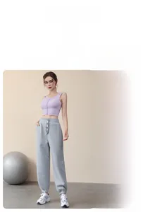 Detail view of loose fit high waist joggers with stylish button placket decoration