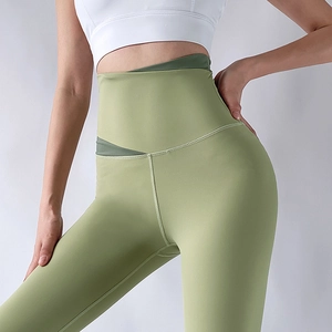 High waist olive yoga leggings with contrast color cross-waist design and elastic fabric