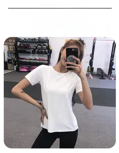 Close-up of a white quick-dry fitness T-shirt with a classic round neck for yoga and training