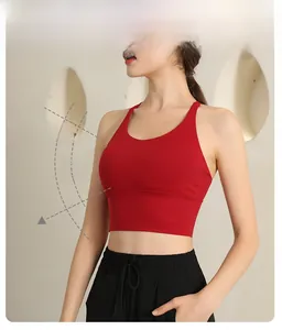 Detail view of red high-impact sports bra featuring wide bottom band and racerback design