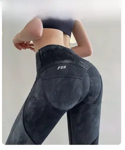 Close-up of high waist tie-dye yoga leggings with scrunch butt detail and PUH logo
