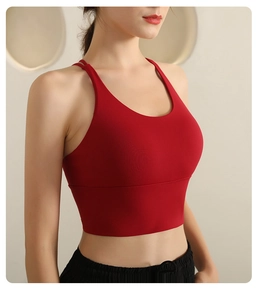 Close-up of vibrant red sports bra featuring cross-back straps and elastic fiber fabric