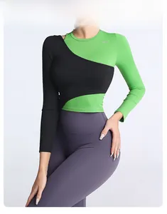Détail du haut de yoga color-block avec couche intérieure vert fluo et superposition noire