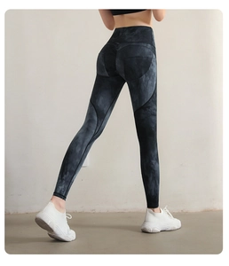 Detail showing high-waist yoga leggings with black and gray tie-dye texture and push-up effect