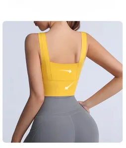 Detail view of the breathable back cutout and wide supportive band on yellow sports bra