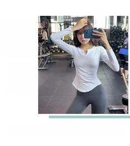 Detail showing white long-sleeved slim-fit sports top and grey yoga leggings in gym setting