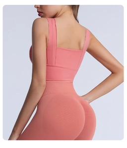 Detail view of pink racerback sports bra and seamless yoga pants showing fabric texture