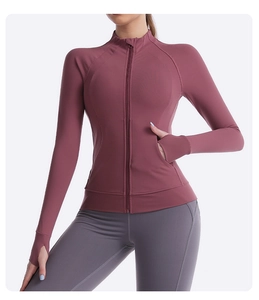 Detail of burgundy slim fit yoga jacket featuring stand collar and thumb holes