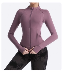 Detail showing high-collar zipper yoga jacket with thumbholes in dusty rose color